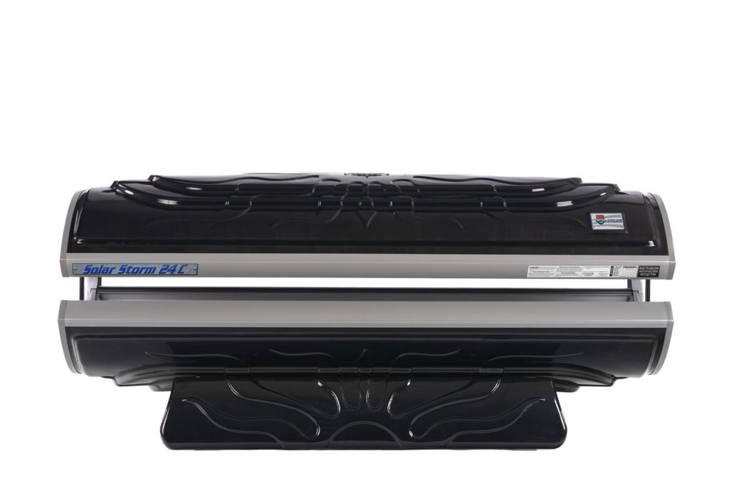A modern tanning bed displayed in a clean, bright, and professional wellness studio space.
